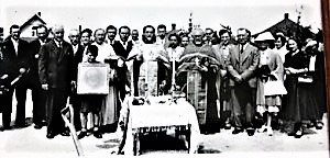 Father Philemon and parishioners blessing ground 1.jpg