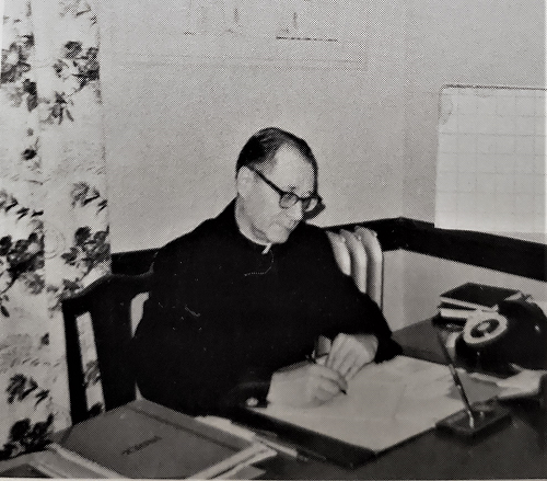 Archpriest George Pokrowsky in the office 1968 1.png